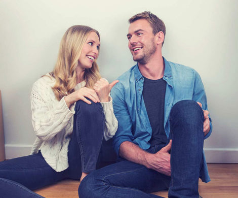 Couple resting after packing for moving