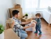 Family playing with child and packing