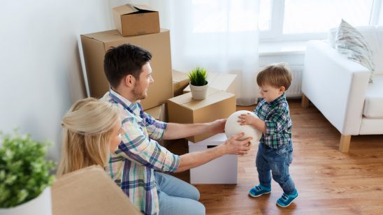 Family playing with child and packing