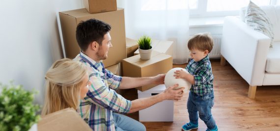 Family playing with child and packing