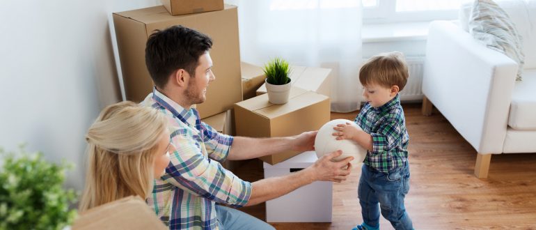 Family playing with child and packing